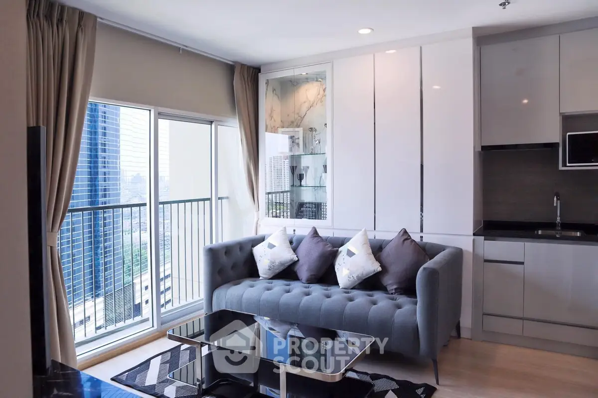 Chic urban living room with modern furnishings, sleek kitchen, and a captivating city view from the balcony, perfect for cosmopolitan living.