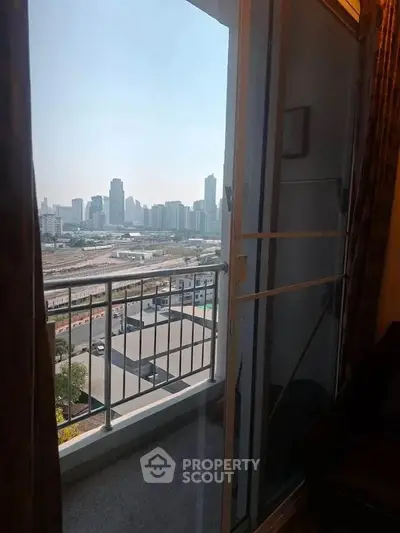 Stunning city view from a high-rise balcony, perfect for urban living.