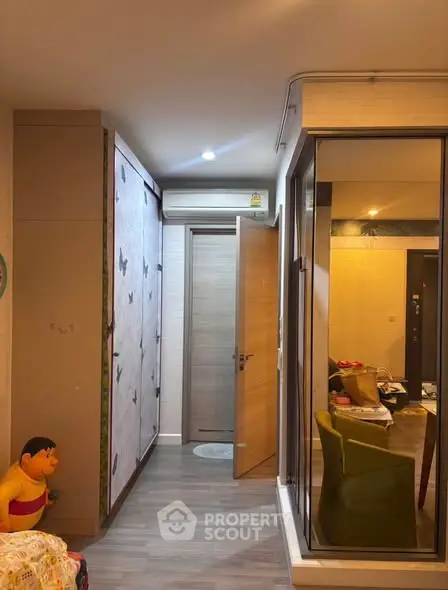 Modern apartment interior with stylish decor and open layout, featuring a cozy living area and sleek flooring.