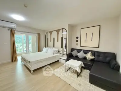 Spacious modern bedroom with stylish decor and mountain view balcony access.