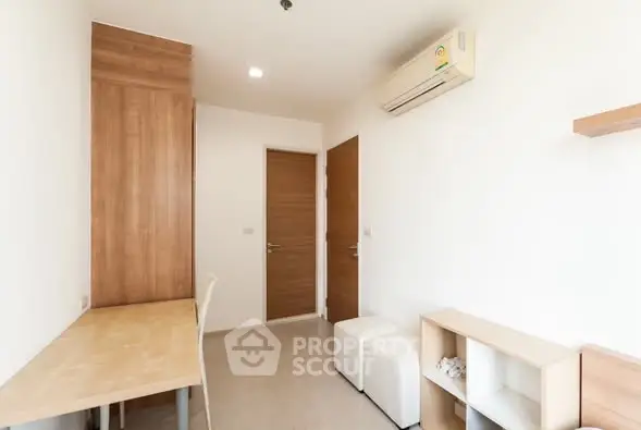 Modern minimalist study room with wooden desk and air conditioning