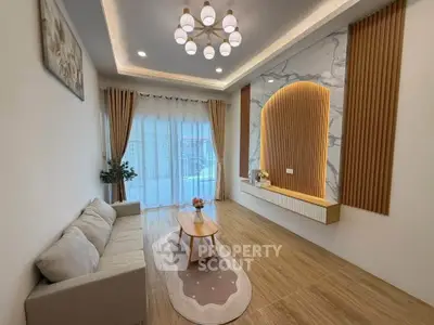 Elegant living room with modern lighting and stylish decor, featuring a cozy sofa and wooden accents.