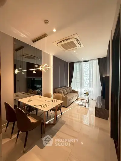 Luxurious modern living room with elegant dining area and stylish lighting in a high-end apartment.