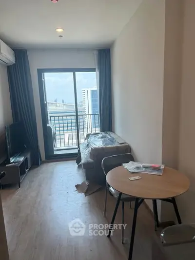 Modern living room with balcony view in urban apartment