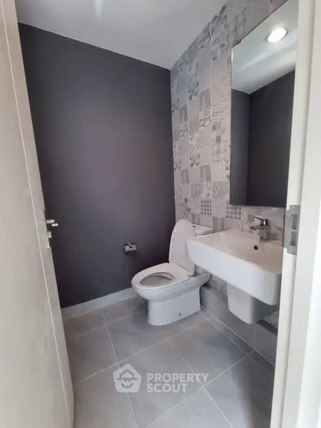 Modern bathroom with stylish tile design and sleek fixtures