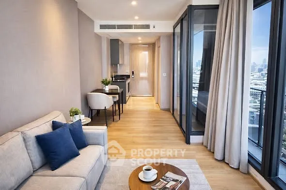 Modern living room with city view, cozy sofa, and stylish decor