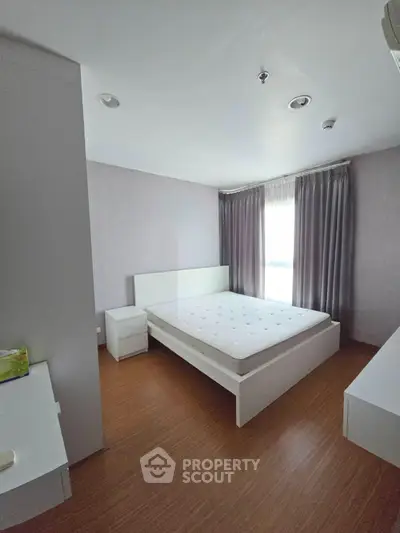 Spacious bedroom with modern design and natural light