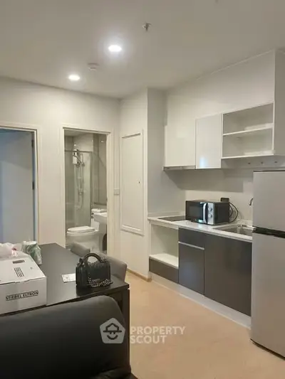 Modern compact kitchen with sleek appliances and open layout