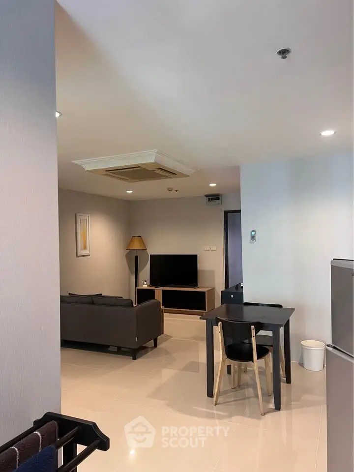 Modern living room with sleek furniture and open layout, perfect for urban living.