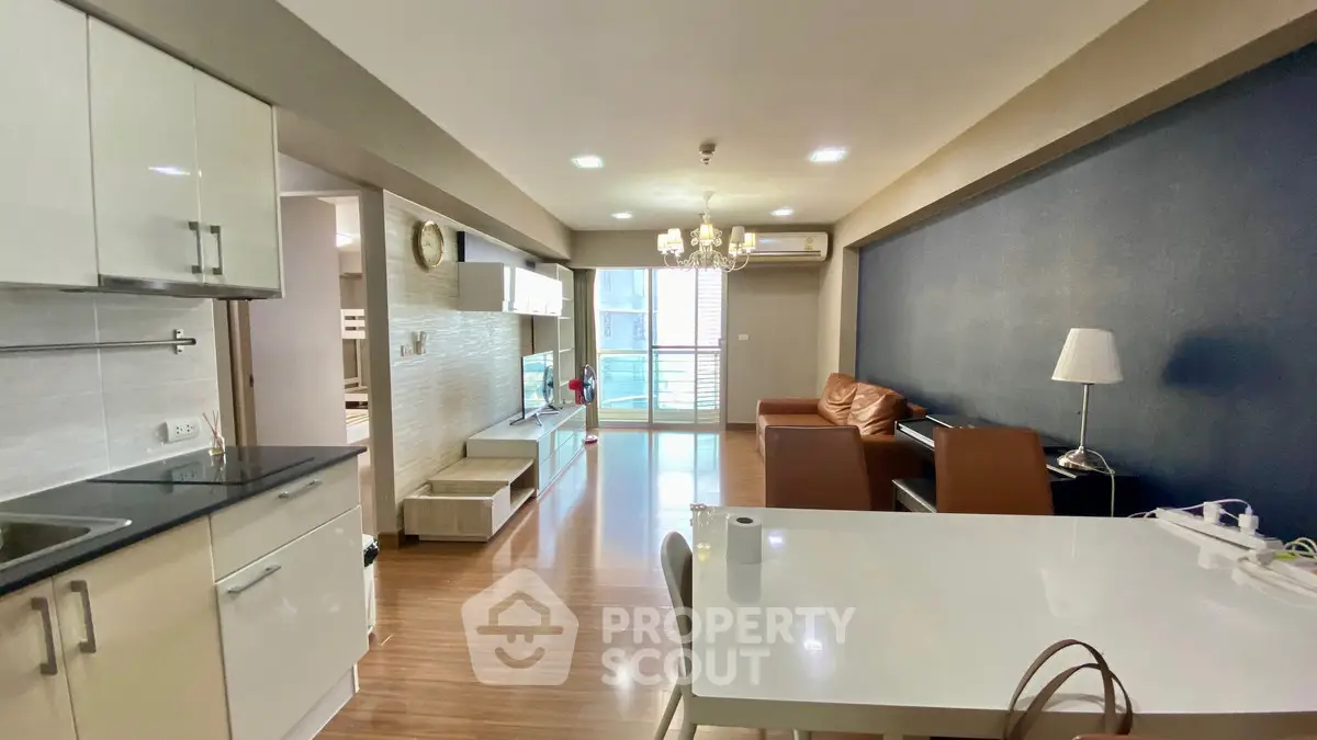 Modern living room with open layout and stylish furniture in a bright apartment.