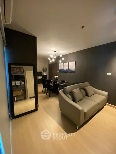 Modern living room with stylish decor and elegant lighting in a cozy apartment.