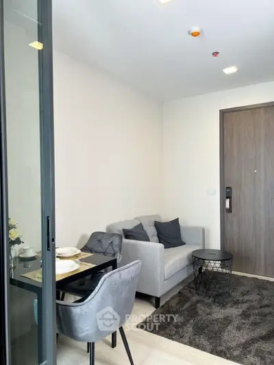 Modern living room with cozy sofa and dining area in stylish apartment