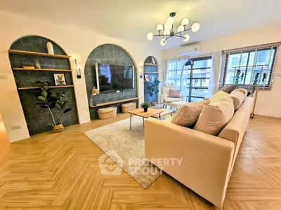 Spacious modern living room with stylish decor and large windows