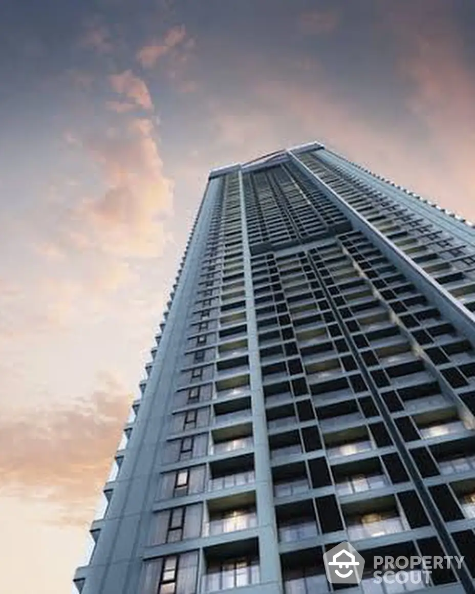 Majestic high-rise tower against a twilight sky, showcasing modern architecture and luxury living spaces with potential for stunning city views.