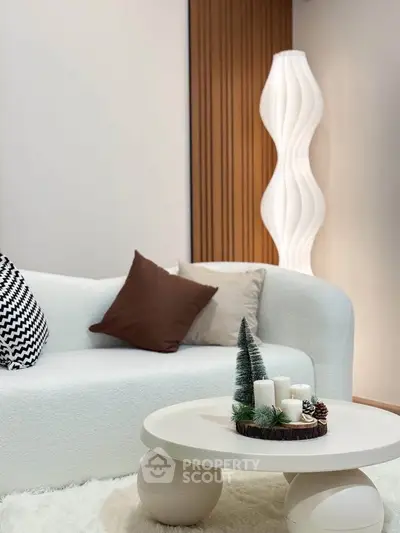 Modern living room with stylish white sofa and unique floor lamp