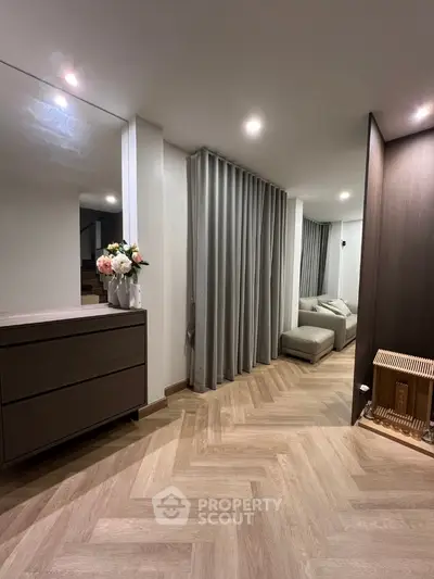 Modern living room with elegant decor and cozy seating area
