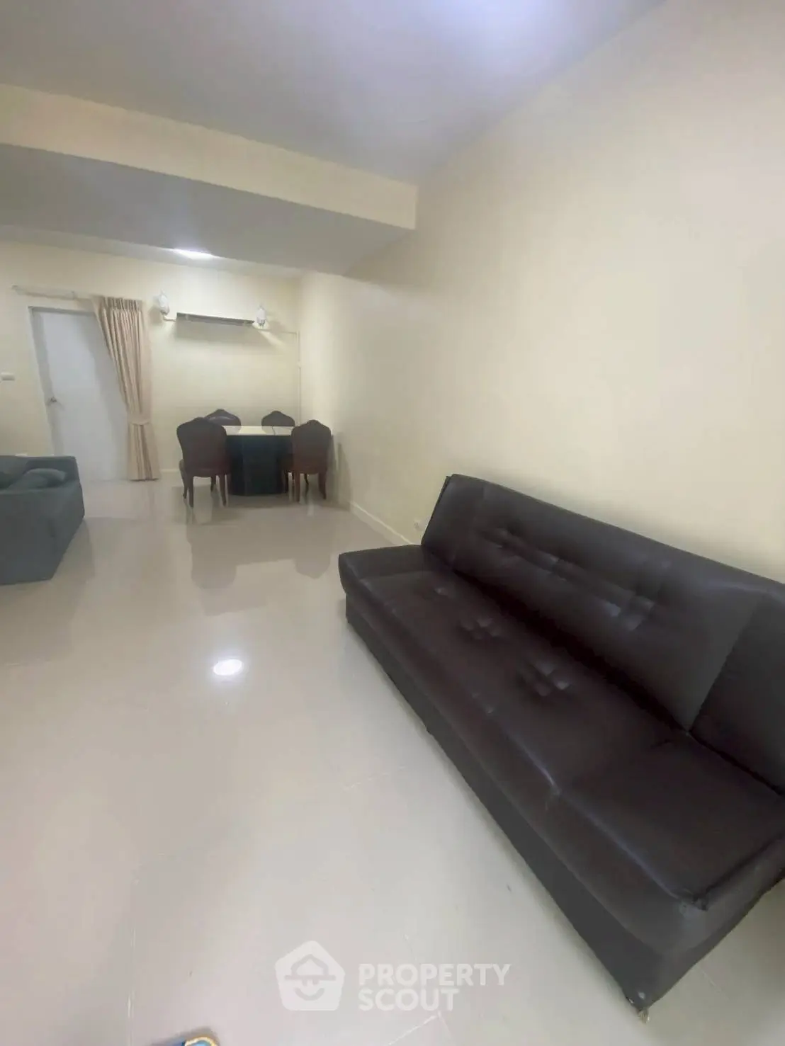 Spacious living room with modern furniture and sleek design