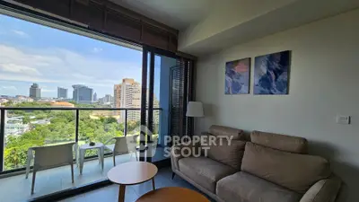 Modern living room with stunning city view and cozy seating area.