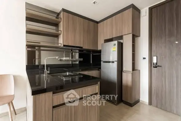 Modern kitchen with sleek cabinetry and stainless steel appliances