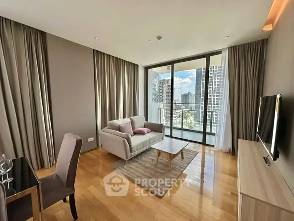 Modern living room with floor-to-ceiling windows and city view, featuring stylish furniture and elegant decor.