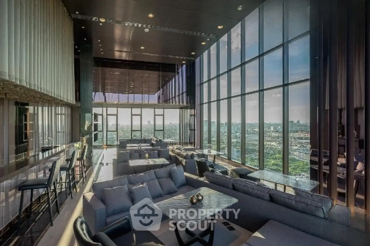 Luxurious high-rise living room with panoramic city views and modern furnishings.