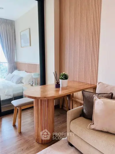 Stylish modern bedroom with wooden accents and cozy seating area.