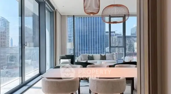 Luxurious modern living room with panoramic city views and elegant decor.