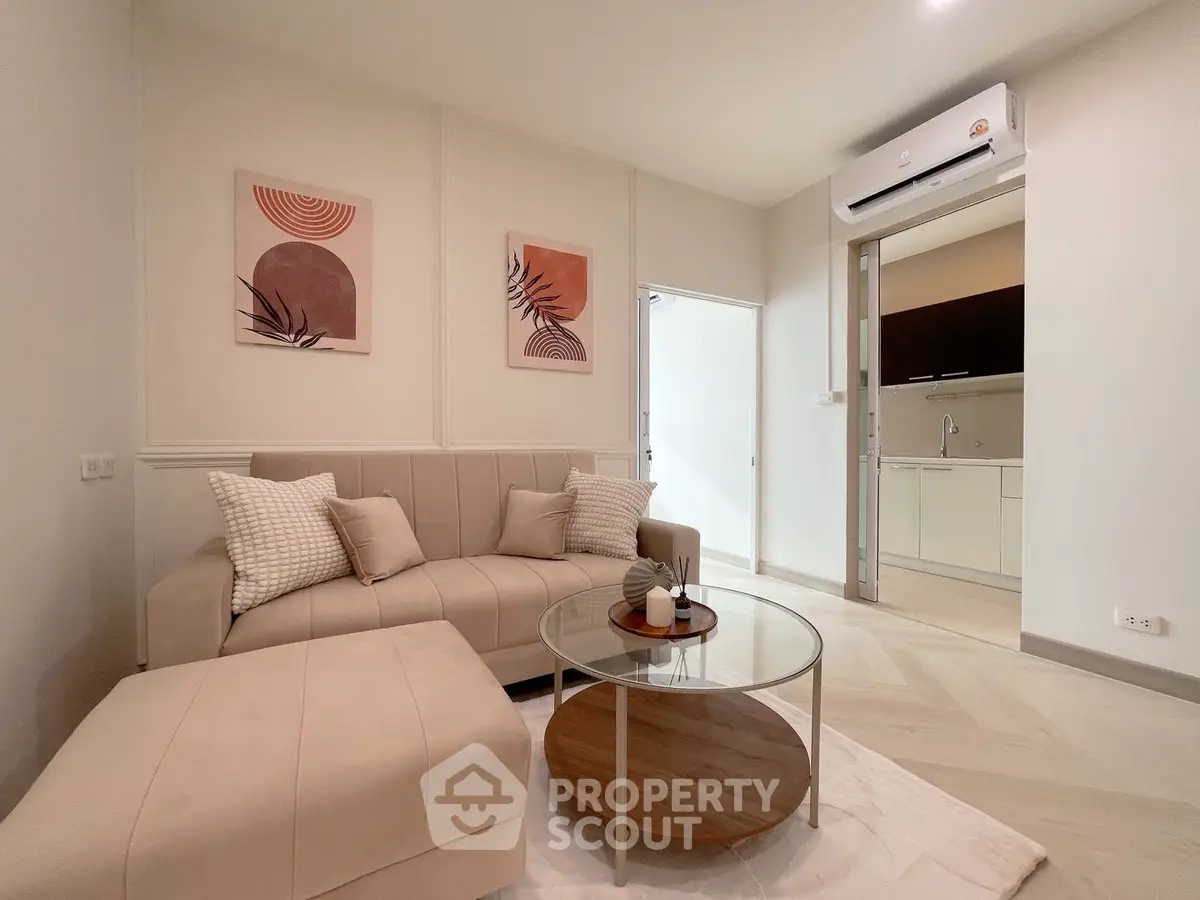 Modern living room with stylish decor and open kitchen layout