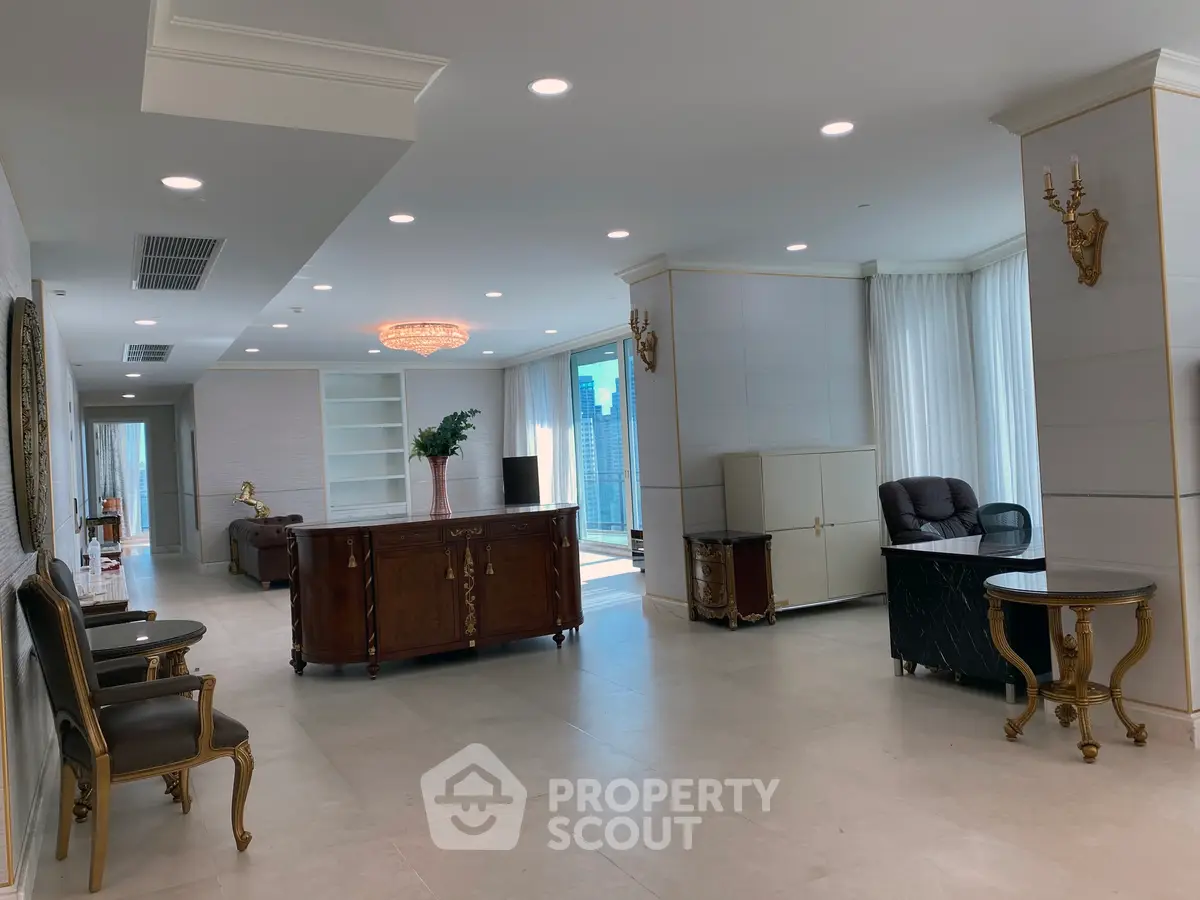 Luxurious living room with elegant furniture and large windows offering natural light.