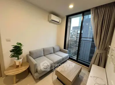 Modern living room with cozy sofa and city view balcony