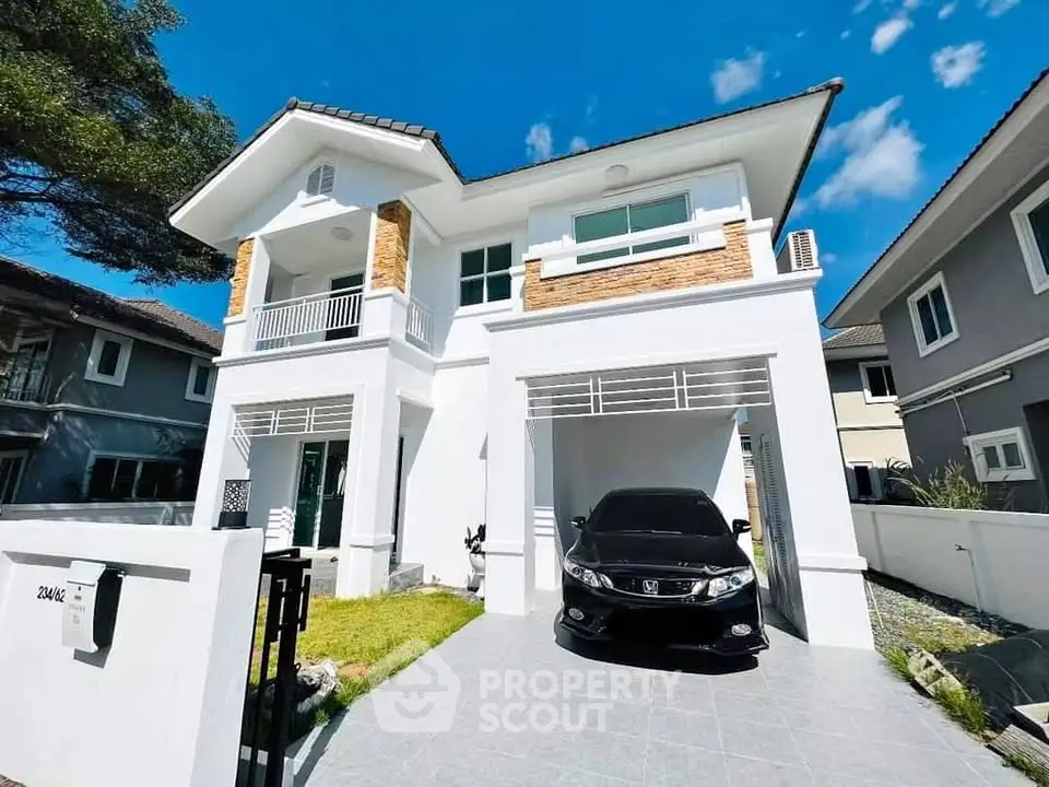 Stunning modern two-story house with driveway and car, perfect for family living.