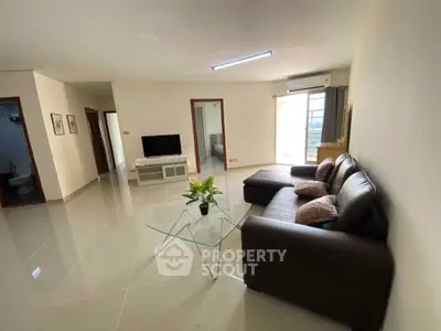 Spacious living room with modern furniture and natural light