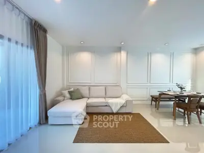 Spacious living room with elegant dining area and modern decor