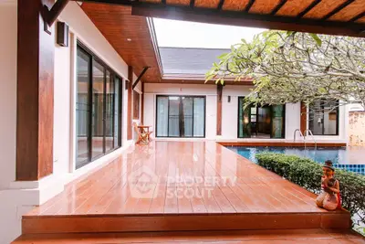 Luxurious villa with wooden deck and private pool, perfect for serene living.