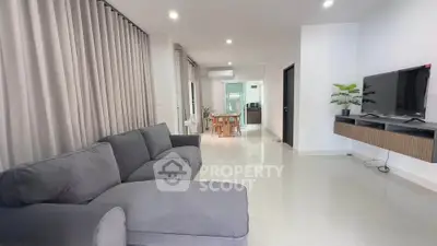 Spacious modern living room with sleek design and comfortable seating