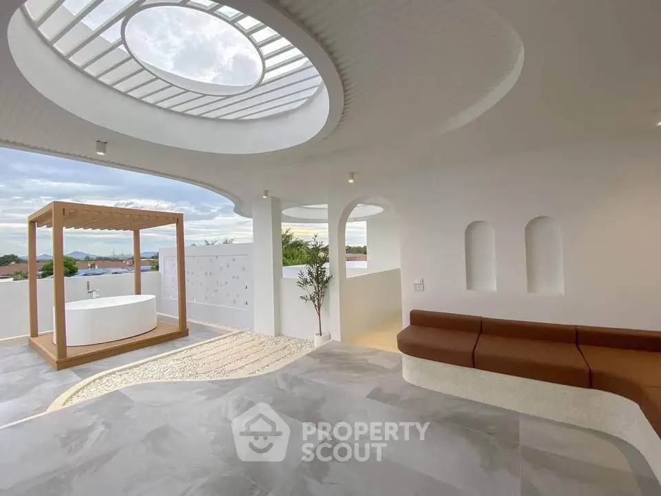 Stunning rooftop terrace with modern design and outdoor bathtub, offering breathtaking views.
