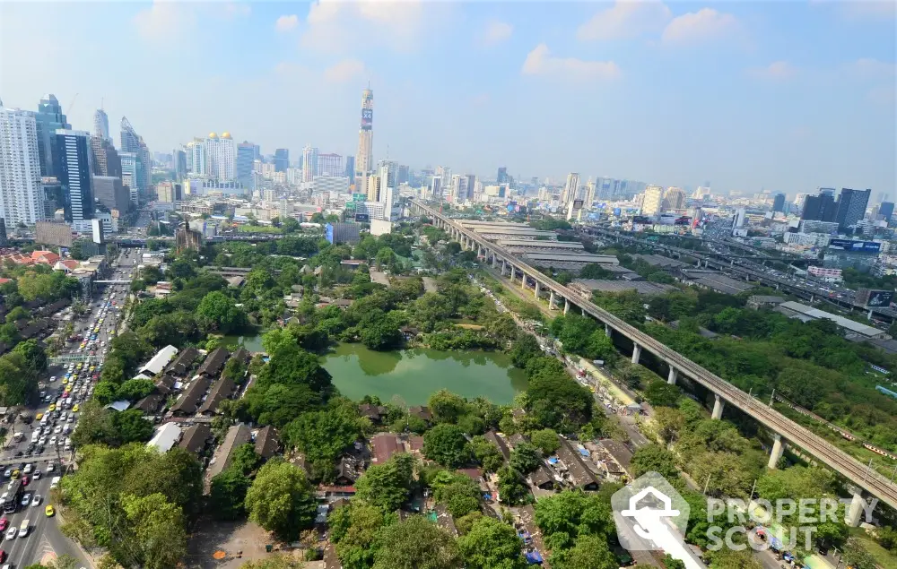 Stunning cityscape view with lush greenery and urban skyline, perfect for real estate investment.