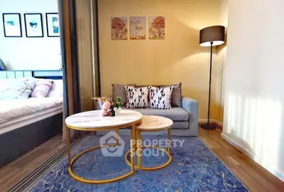 Chic modern living room with cozy sofa and stylish coffee tables, perfect for relaxation.