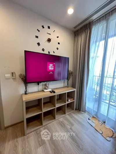 Modern living room with stylish TV setup and large window view