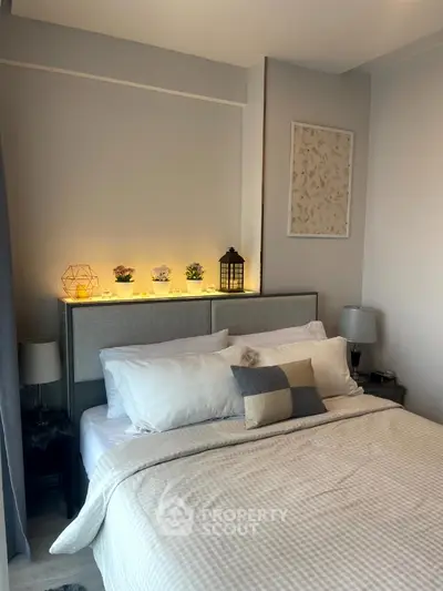 Cozy modern bedroom with stylish decor and ambient lighting