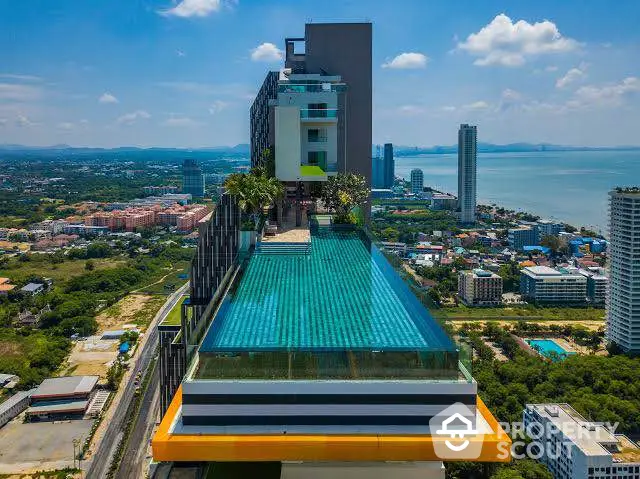 Stunning rooftop pool with panoramic ocean view in luxury high-rise building