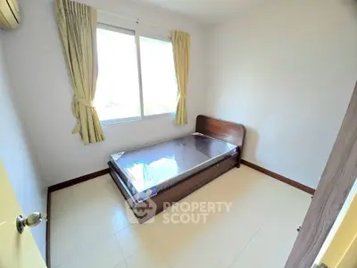 Cozy bedroom with natural light and minimalist design