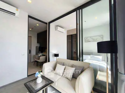 Modern living room with cozy sofa and stylish decor in a contemporary apartment.