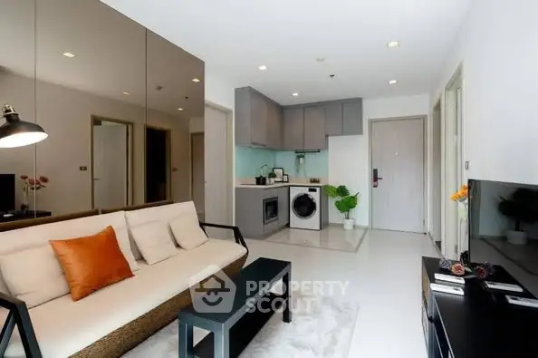 Modern living room with open kitchen and stylish decor