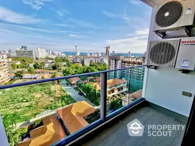 Stunning balcony view of cityscape and ocean from high-rise apartment