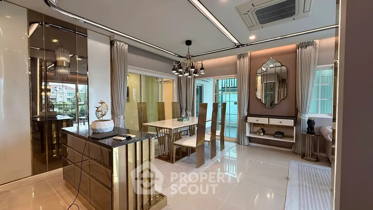 Luxurious dining area with modern decor and elegant lighting in a stylish apartment.