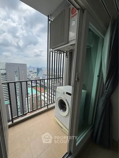 High-rise balcony with city view and washing machine, perfect for urban living.