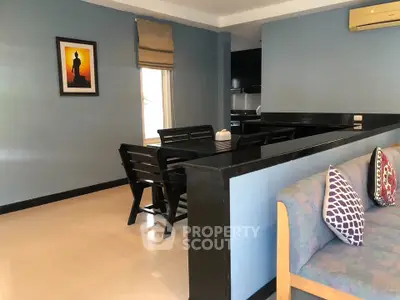 Charming living room with modern decor and dining area in cozy apartment