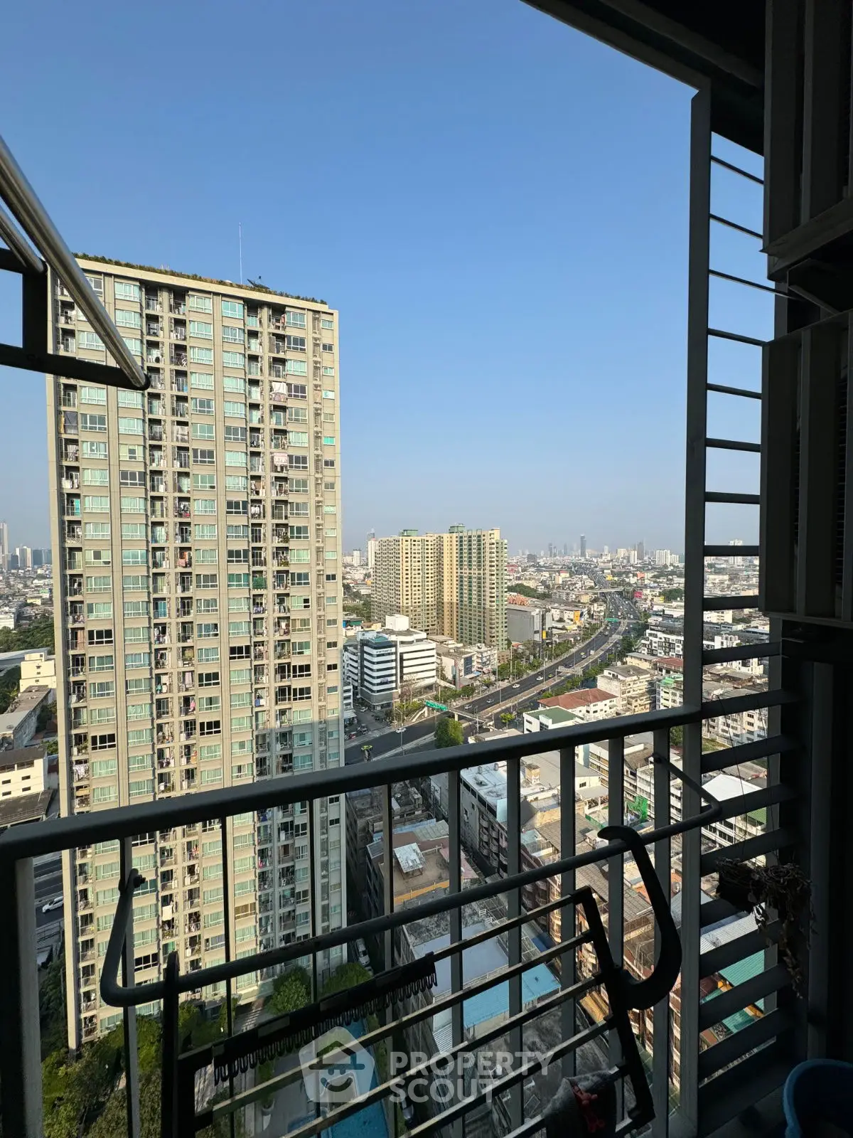 Stunning cityscape view from a high-rise balcony, perfect for urban living enthusiasts.
