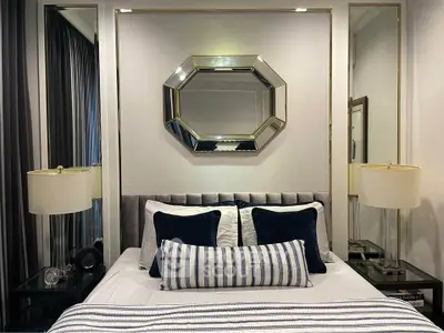 Luxurious bedroom with elegant decor and stylish mirror accent